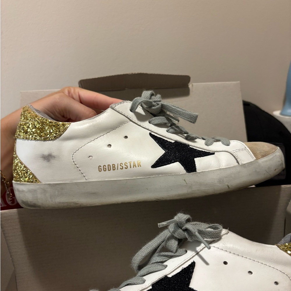 Golden Goose Superstar Sneakers with Gold and Black Accents